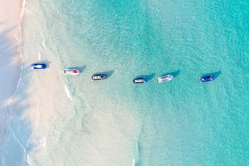 Bird's-eye view of a row of jet ski at the Beach. Converted from RAW.