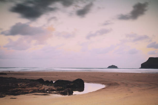 Early morning view over the beach at Polzeath Vintage Retro Filter. stock photo
