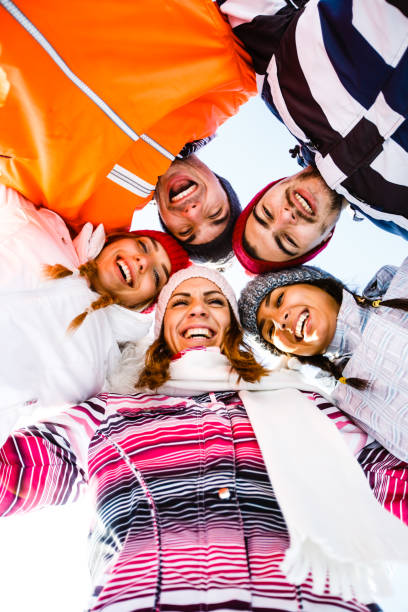 istock Friends in ski-wear smiling at camera 641342116
