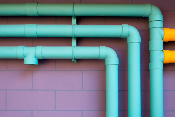 istock Colorful pipeline on purple wall 641345768