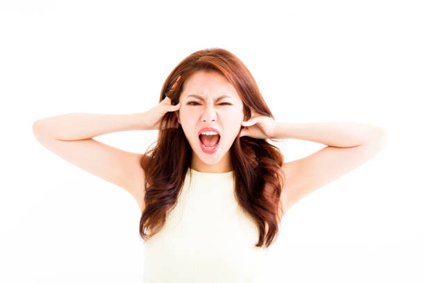 istock young Woman stressed  going crazy and pulling her hair 641346224