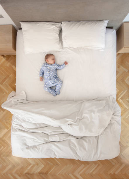 Family in bed. Photo taken directly from above.