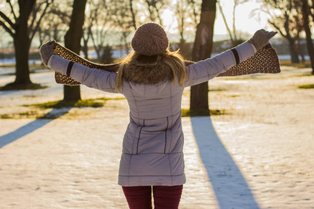 istock Woman on winter day in a park 641347944