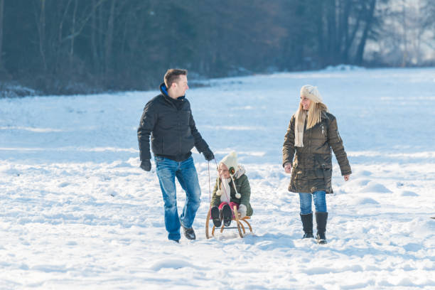 istock Family haveing fun on snow 641348034