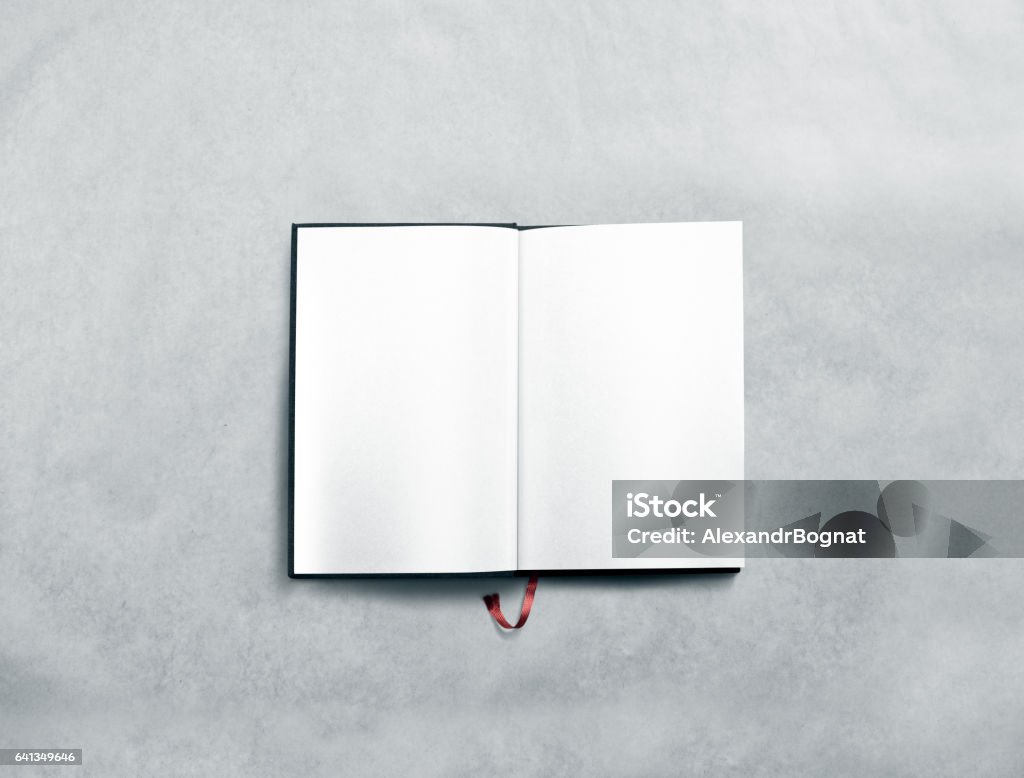 Blank opened book spread mock up with white pages Blank opened book spread mock up with white pages. Reading empty paperback mockup. Black notebook inside template. Brochure design isolated on textured paper. Textbook spread with bookmark. Book Stock Photo