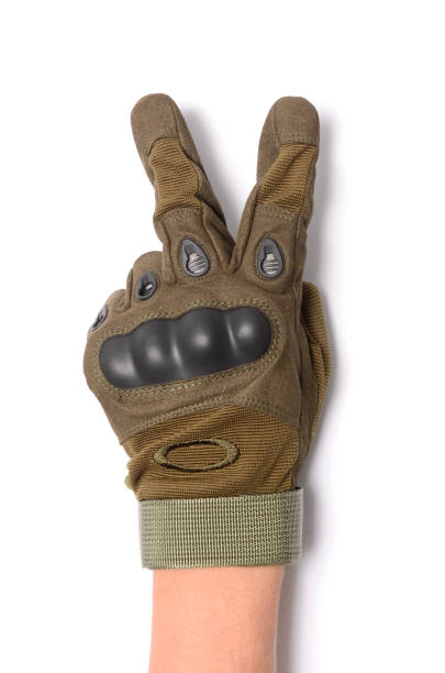 istock Hand with peace sign, tactical gloves, wrist 641350022