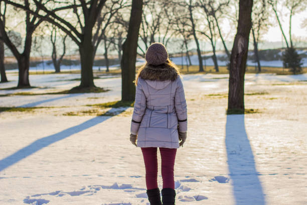 istock Woman on winter day in a park 641350546