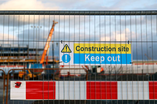 istock Construction site warning signs in yellow and blue instructing people to Keep Out. 641352356