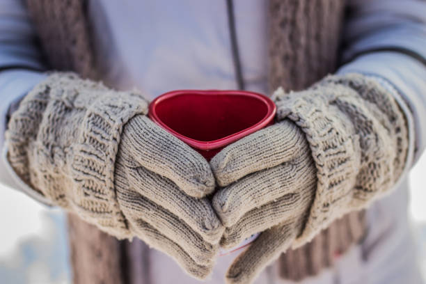 istock Woman holding a cup of tea 641352878