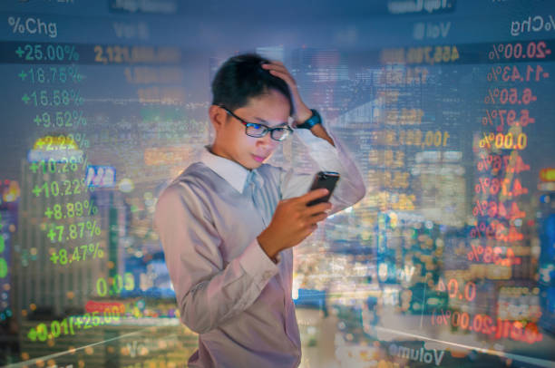 istock Young business man using laptop and digital tablet cityscape background 641354174