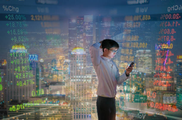 istock Young business man using laptop and digital tablet cityscape background 641354222