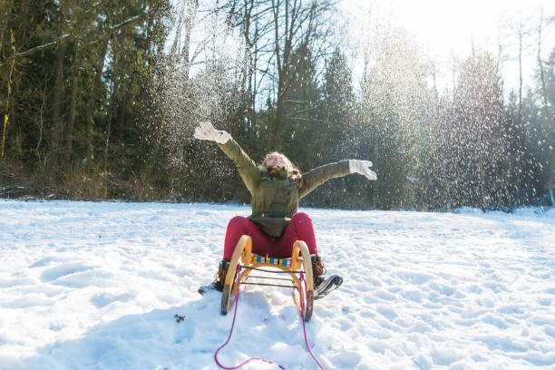 istock Young girl haveing fun on sleds 641355078