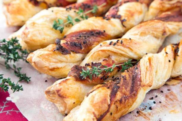 Bacon sticks pastry with black sesame and thyme stock photo