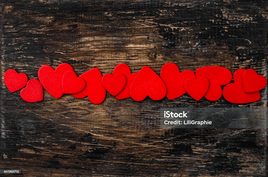 Valentines Day Decoration. Red Hearts on wooden background Valentines Day Decoration. Red Hearts. Love concept Backgrounds Stock Photo