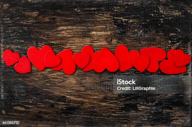 Valentines Day Decoration Red Hearts On Wooden Background Stock Photo - Download Image Now