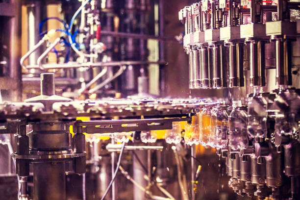 istock Bottles on Conveyor Belt in Factory 641355788