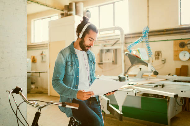 istock Male Carpenter Working In His Workshop 641357386
