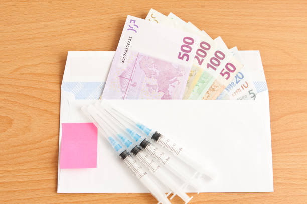 Syringes and banknotes EURO stock photo