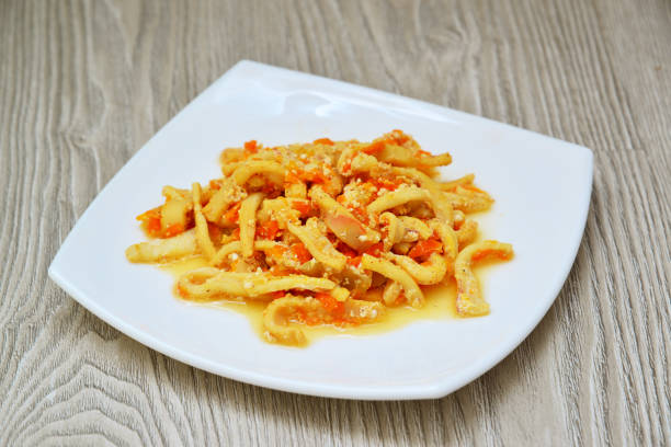 istock Calamaries stewed in cream sauce with carrots 641358236