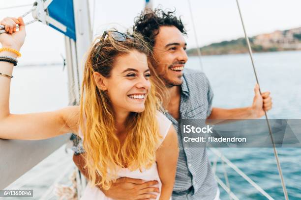 Couple Sailing On A Yacht Stock Photo - Download Image Now - Couple - Relationship, Sailing, Vacations