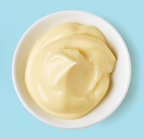 istock Bowl of mayonnaise on blue background; from above 641363846