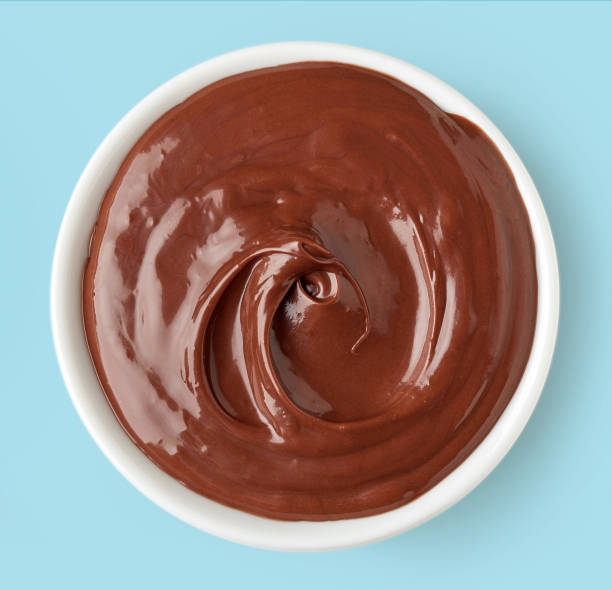 istock Chocolate cream in round dish on blue background 641365260
