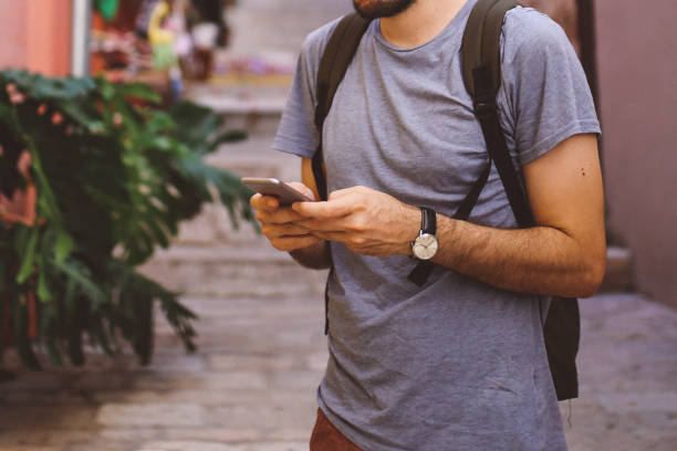 istock Tourist backpacker traveling in Rovinj, checking cellphone 641366002