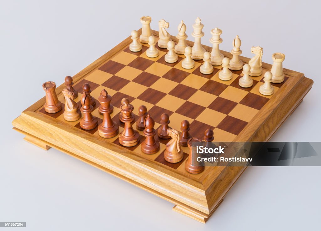 Chess Pieces In Starting Position On A Wooden Board Stock Photo - Download  Image Now - iStock