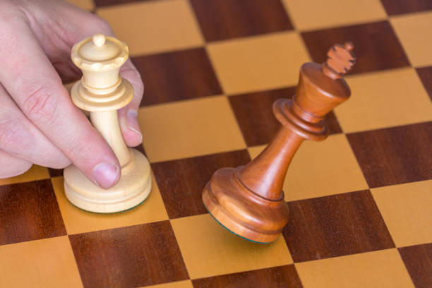 istock The end of a chess game a player wins king with queen 641367220