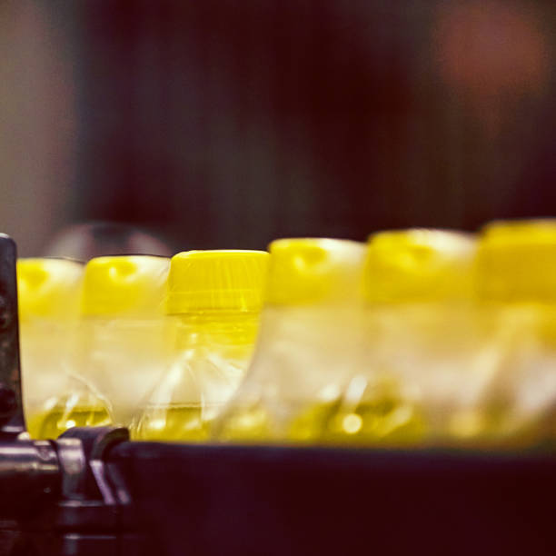 istock Bottles on Conveyor Belt in Factory 641367600