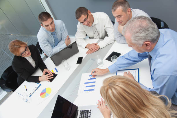 istock Business people discussing market research statistics 641372074