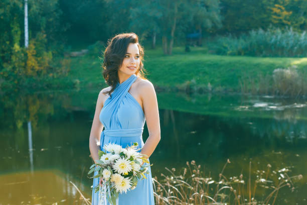 istock Beautiful young bridesmaid with curly hair 641372120