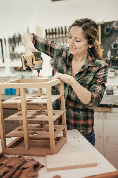 istock Female furniture designer at woodworking studio 641375146