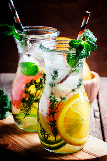 Citrus cool lemonade in glass jugs