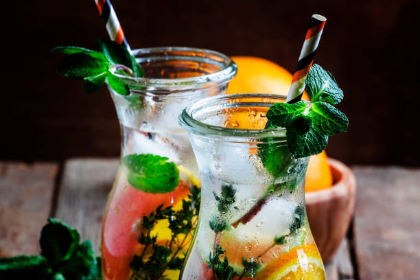 Citrus cool lemonade in glass jugs