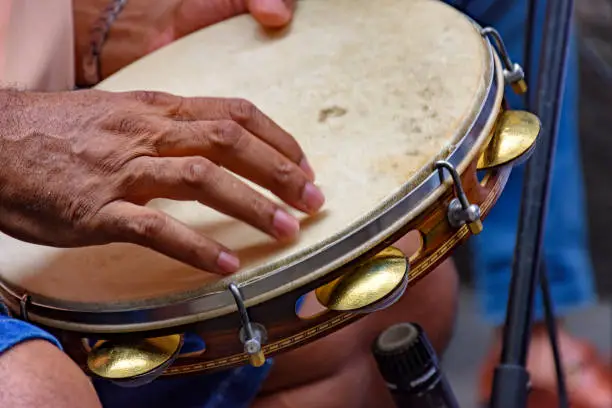 Tambourine being played by a ritimist during a samba performance in Rio de Janeiro