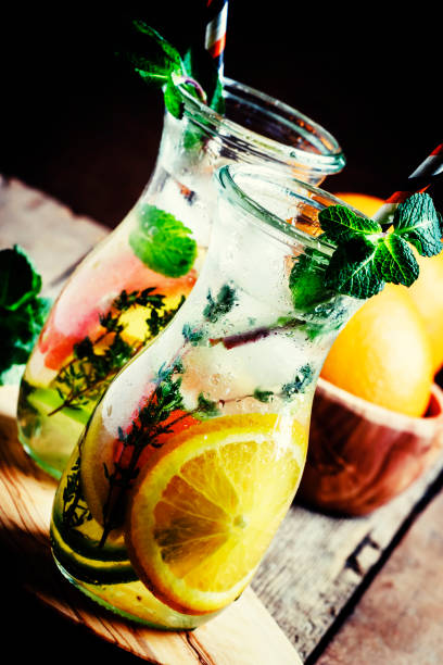 Citrus cool lemonade in glass jugs