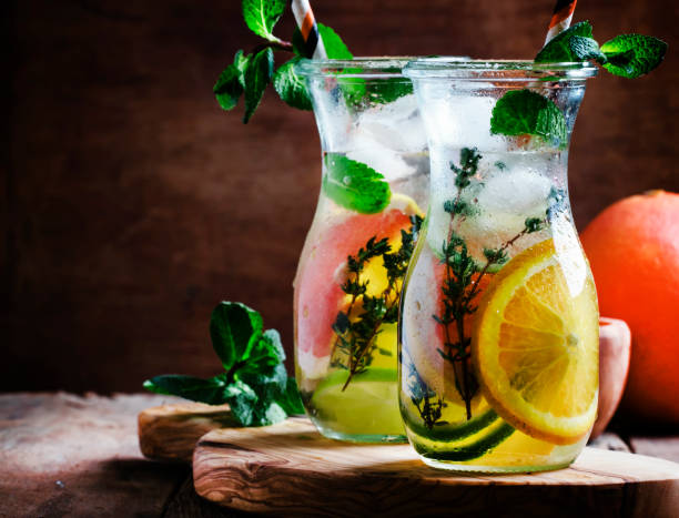 Citrus cool lemonade in glass jugs