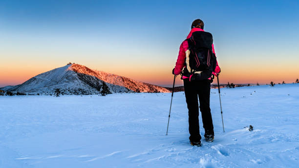 istock Young female trekker watching sunset in the mountains 641379776