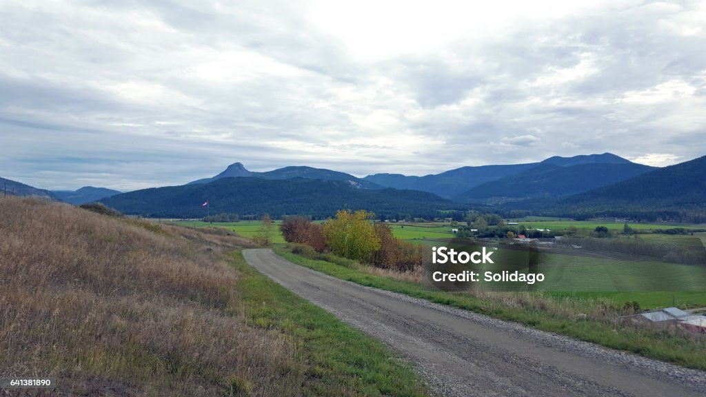 Pastoral Rural Okanagan Valley Landscape In Autumn Rural Farmland and mountain range East of Vernon BC  near the small town of Lumby Agriculture Stock Photo