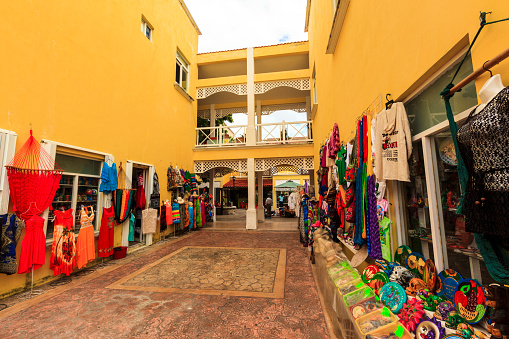 COZUMEL MEXICO JAN 27 2016:Colorful souvenir, coffee shops located in town. Tourists can buy various souvenirs as a memory about beautiful Tropical Island. The economy of Cozumel is based on tourism.