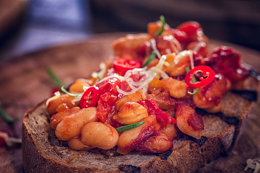 Baked beans with chili on toasted bread