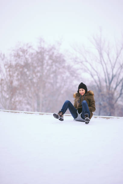 istock Pretty Girl Sliding Downhill 641389350