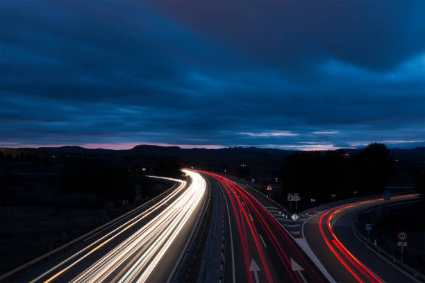 istock Night View of Highway Traffic and Cloudy Sky 641390190