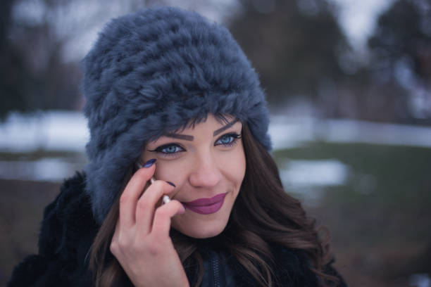 istock Happy young lady talking on mobile phone. close up 641391500