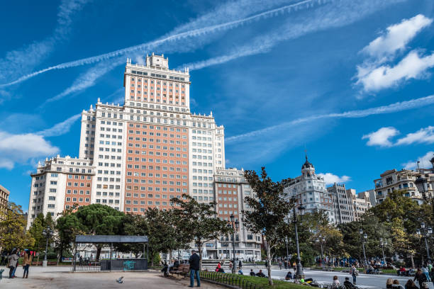 Street in Madrid city Madrid, Spain - November 13, 2016: Spain Square in Madrid. It is a large square, a popular tourist destination located in central Madrid, Spain at the western end of the Gran Vía. It features a monument to Miguel de Cervantes and is adjacent to two of Madrid's most prominent skyscrapers. bailen stock pictures, royalty-free photos & images