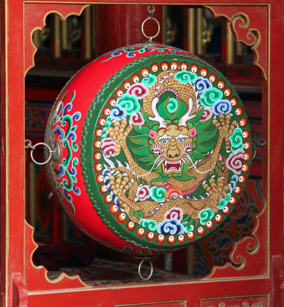istock Hohhot, Inner Mongolia - JUl 8, 2011: Traditional colorful prayer drum in buddhist monastery 641392524