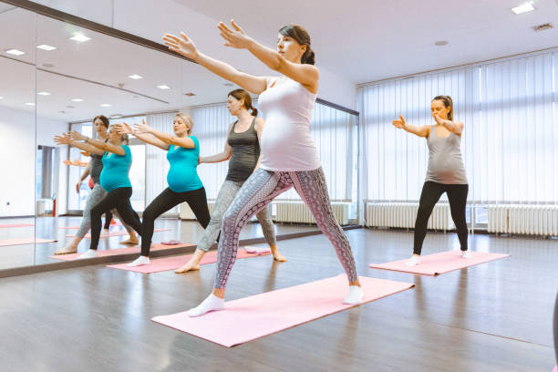 istock Pregnant women on a yoga class 641396504
