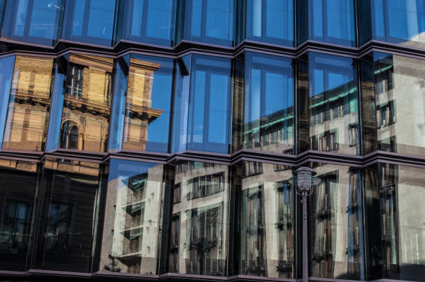 istock Older architectural styles reflected in the windows of a modern office building 641397584