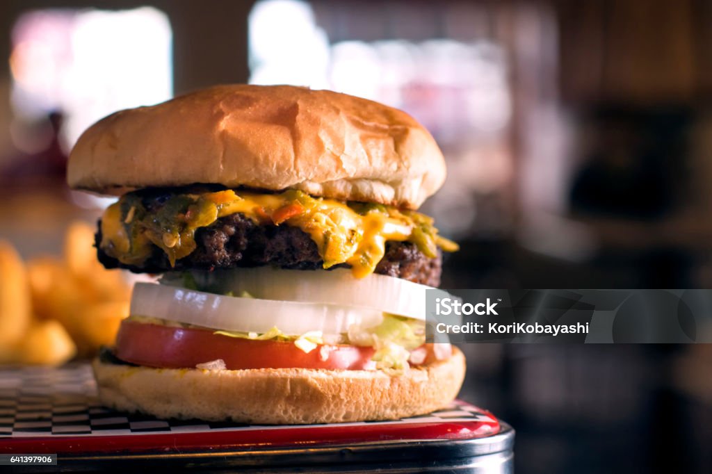 Green Chile Cheese Burger Delicious Green Chile Cheese Burger ready to be eaten. Cheeseburger Stock Photo